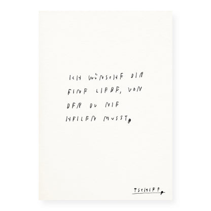 Weißes Poster mit handschriftlichem schwarzen Text auf weißem Hintergrund, eingerahmt in einem schmalen schwarzen Rahmen. Unten rechts steht „tschiff“ in kleiner Schrift. Auf dem Poster steht: „Ich wünsche dir eine Liebe, von der du nie heilen musst“.
